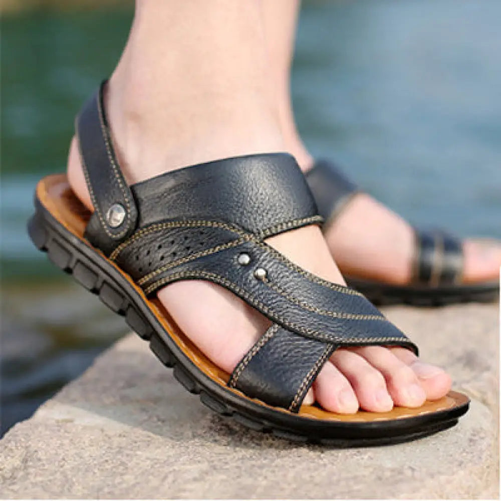 Men’s adjustable black genuine leather summer beach sandals with textured surface stitched straps and silver metal accents