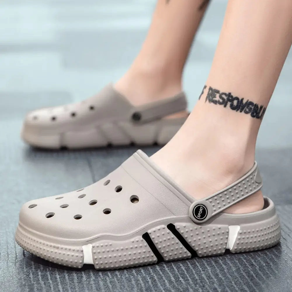Gray men breathable waterproof EVA beach clogs with perforated upper textured rubber sole and circular logo on strap