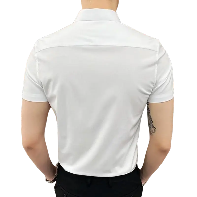 White men short sleeve dress shirt made of smooth crisp cotton blend fabric with a collared design and clean lines