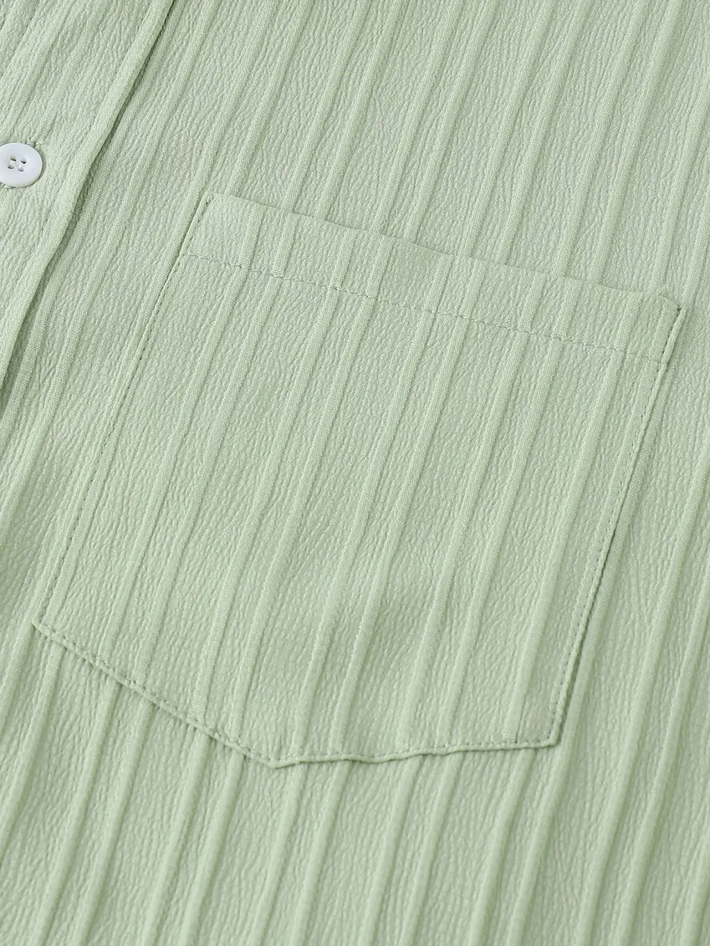 Men short sleeve textured beach shirt in light green ribbed cotton with a single white button and matching pocket