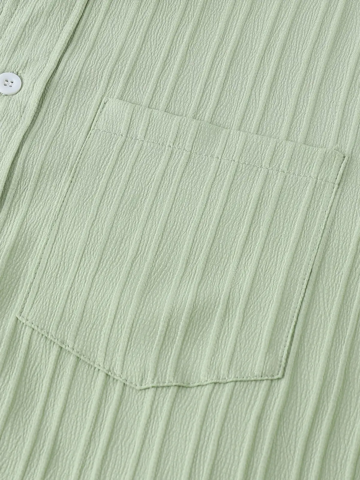 Men short sleeve textured beach shirt in light green ribbed cotton with a single white button and matching pocket
