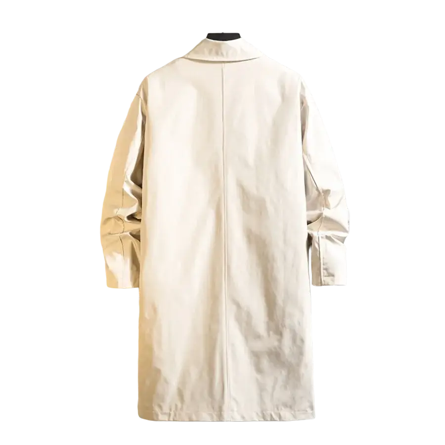 Beige men single breasted trench coat with classic collar and long sleeves hanging on hanger against textured wall