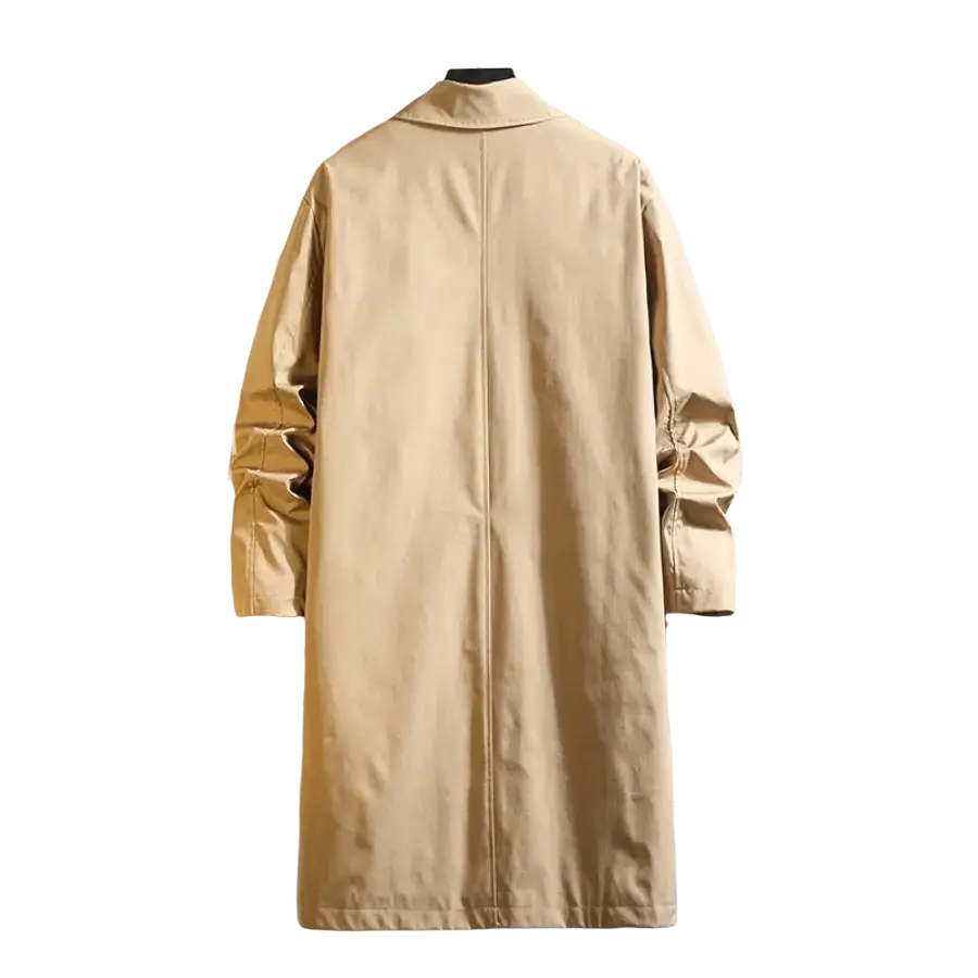 Beige single breasted men trench coat with classic collar and long sleeves hanging on a hanger against textured wall