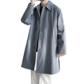 A sleek light gray single breasted men trench coat with classic collar and dark buttons for casual windbreaker use