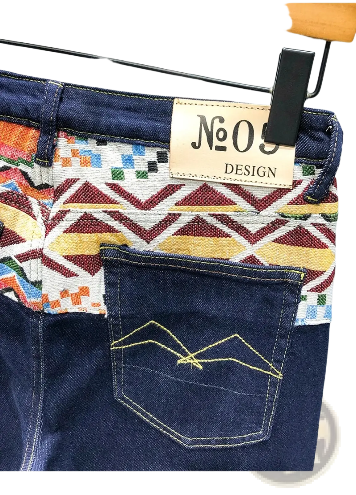 Blue denim men slim fit stretch embroidered jeans back side with colorful geometric waistband and yellow mountain stitching
