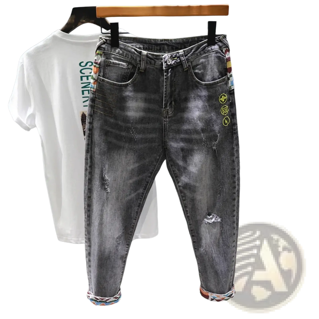 Men slim fit stretch black denim jeans with distressed details colorful embroidered patches and rolled cuffs
