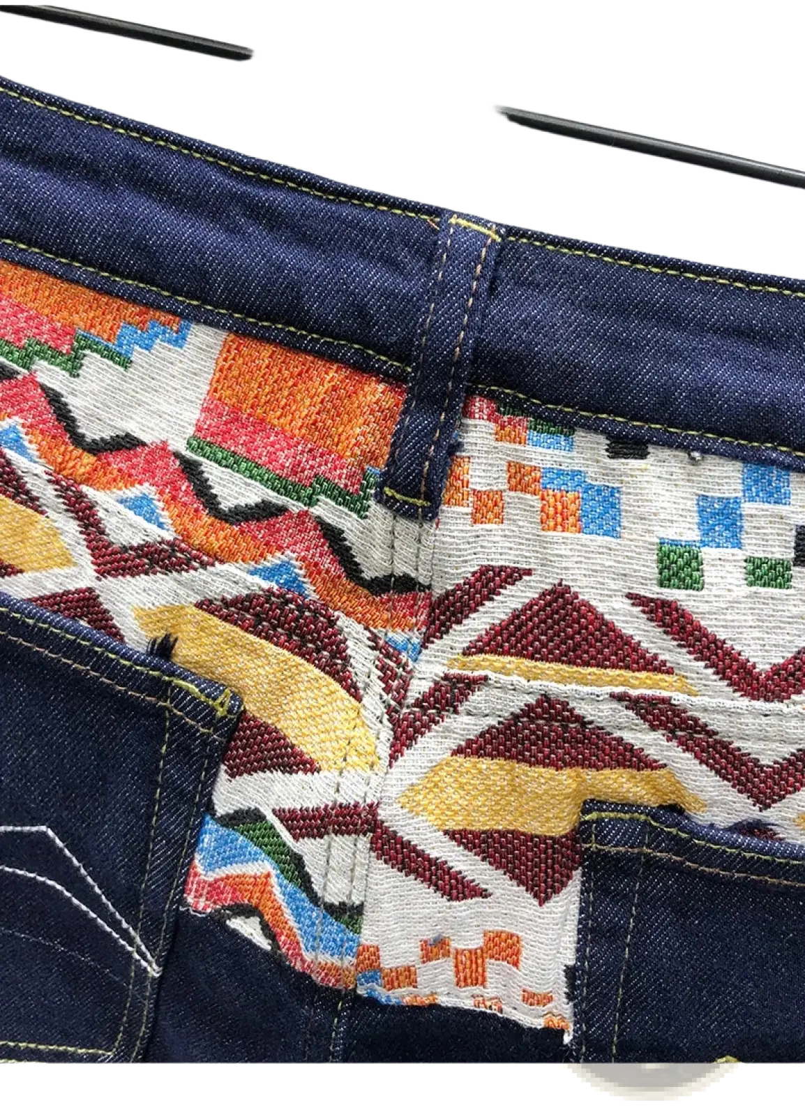 Men slim fit stretch embroidered white denim jeans showing the back side with vibrant geometric pattern on pocket