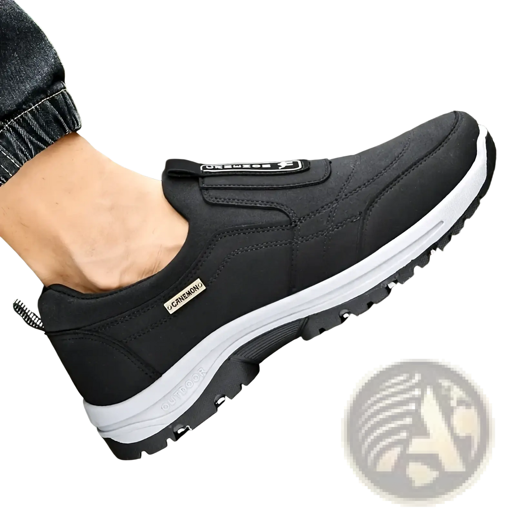 Men slip resistant casual walking sneakers in black with white midsole, velcro strap, and textured rubber outsole