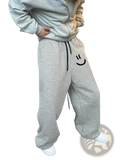 Men smiley face fleece sweatpants in gray featuring a black smiley face embroidery and matching drawstring waistband