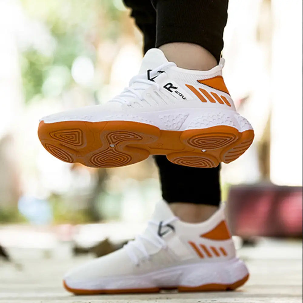 Men’s breathable mesh athletic sports sneakers in white and orange with a mesh upper and rubber outsole