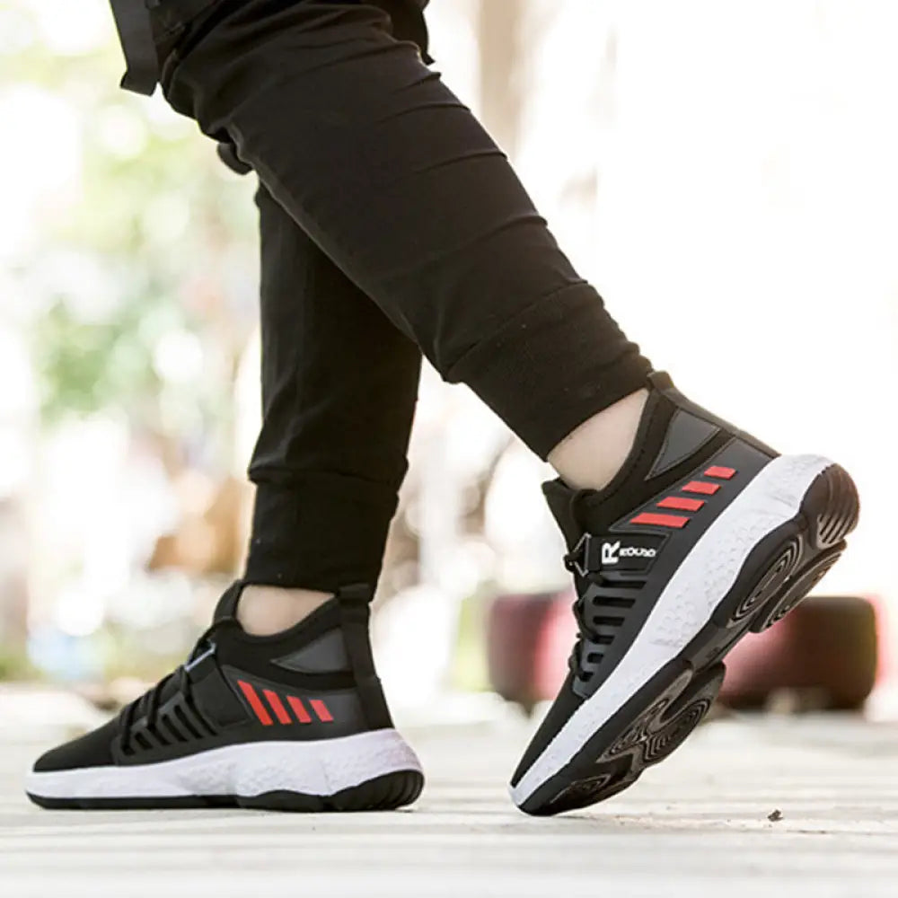 Men’s breathable mesh athletic sports sneakers in black and red with white midsole and bold diagonal stripes on the side