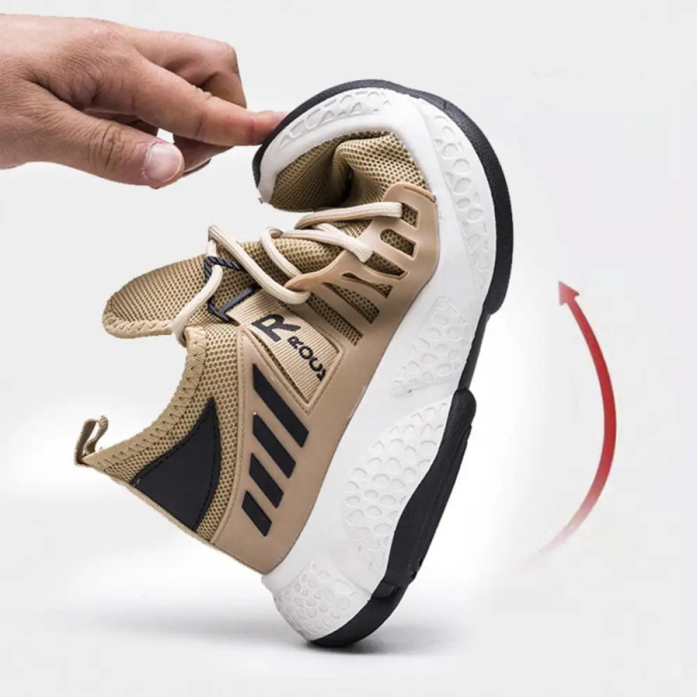 Men’s breathable mesh athletic sports sneaker in tan and black with white rubber sole and reinforced toe cap design