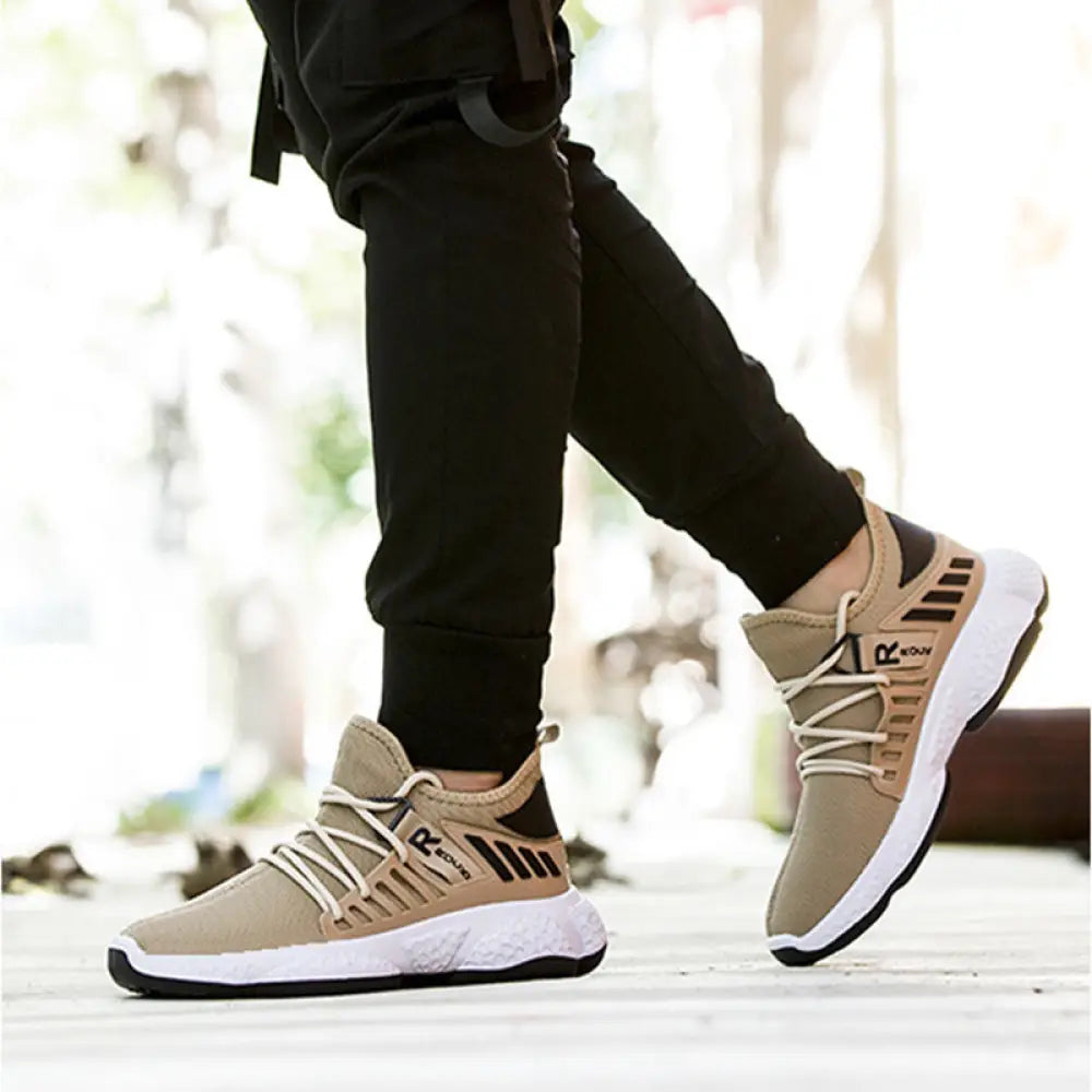 Men’s breathable mesh athletic sports sneakers in beige and black with textured upper and white midsole