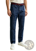 Men straight leg denim jeans in dark blue with a burgundy leather belt and white sneakers for casual wear