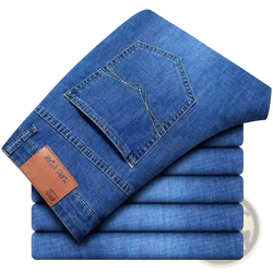 Men straight leg stretch denim jeans in blue with a brown leather brand tag on the waistband back side view