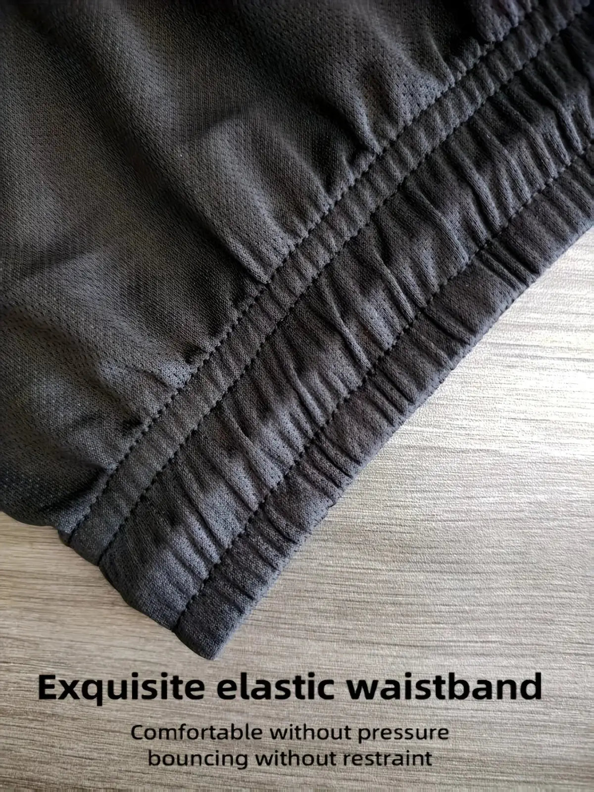 Dark gray elastic waistband with reinforced stitching on men summer sportswear set for quick dry fitness comfort