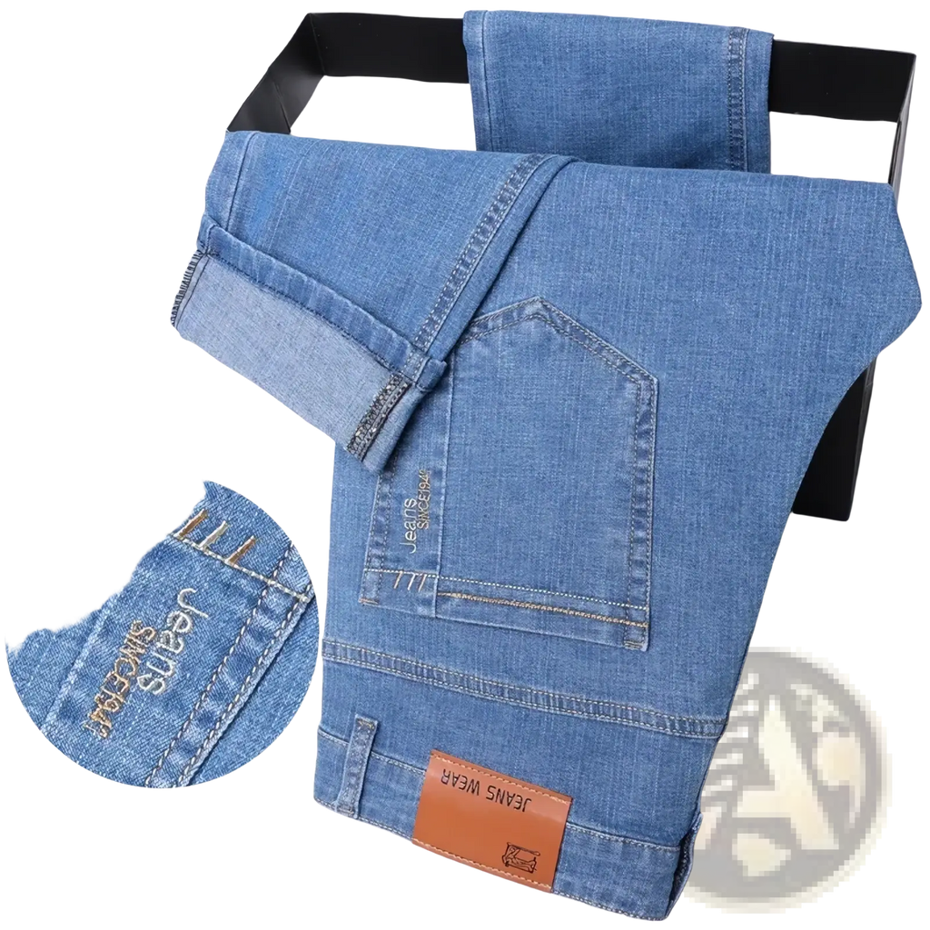 Men summer straight denim jeans in light-wash blue with slim fit, stitched branding, and brown leather waistband patch