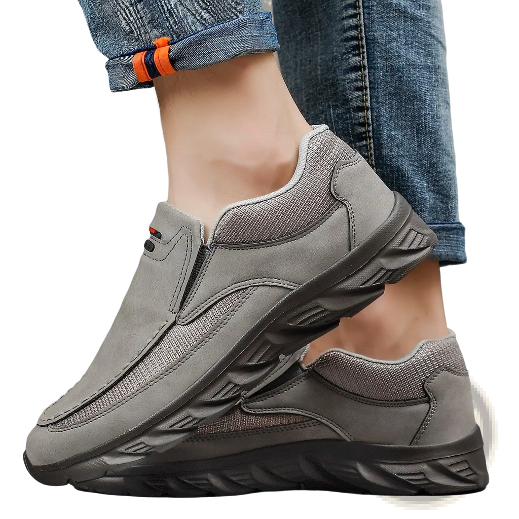 Men tan suede casual slip on shoes with gray suede and mesh upper, black rubber sole, and subtle side branding