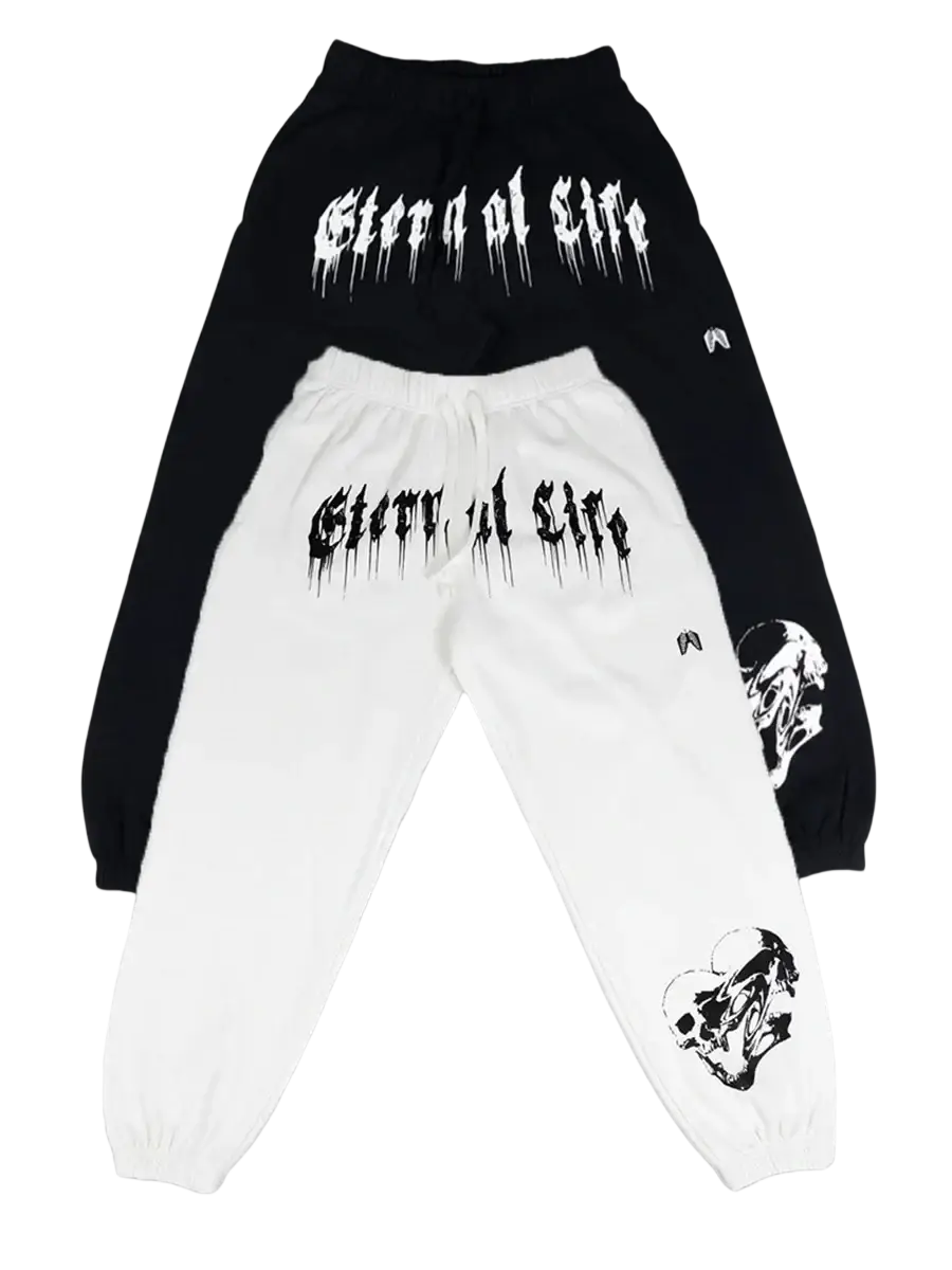 Black and white men training sweatpants with glove a life gothic font on back and skull graphics on lower legs