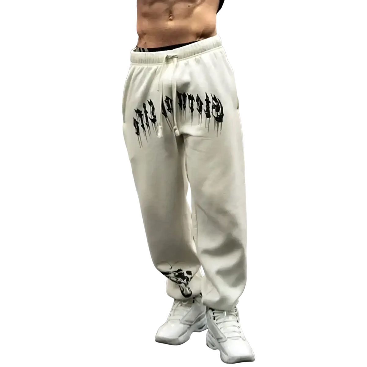 Men training pants cream-colored sweatpants with black dripping lettering and skull graphic at the cuffs for activewear