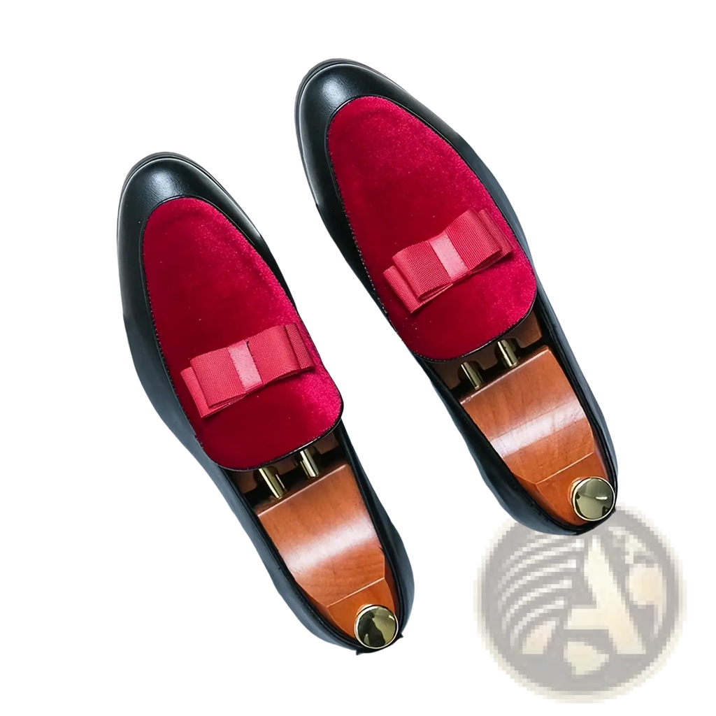 Men velvet dress loafers featuring red velvet bow tie, black leather uppers, and gold tone metal accents for formal wear