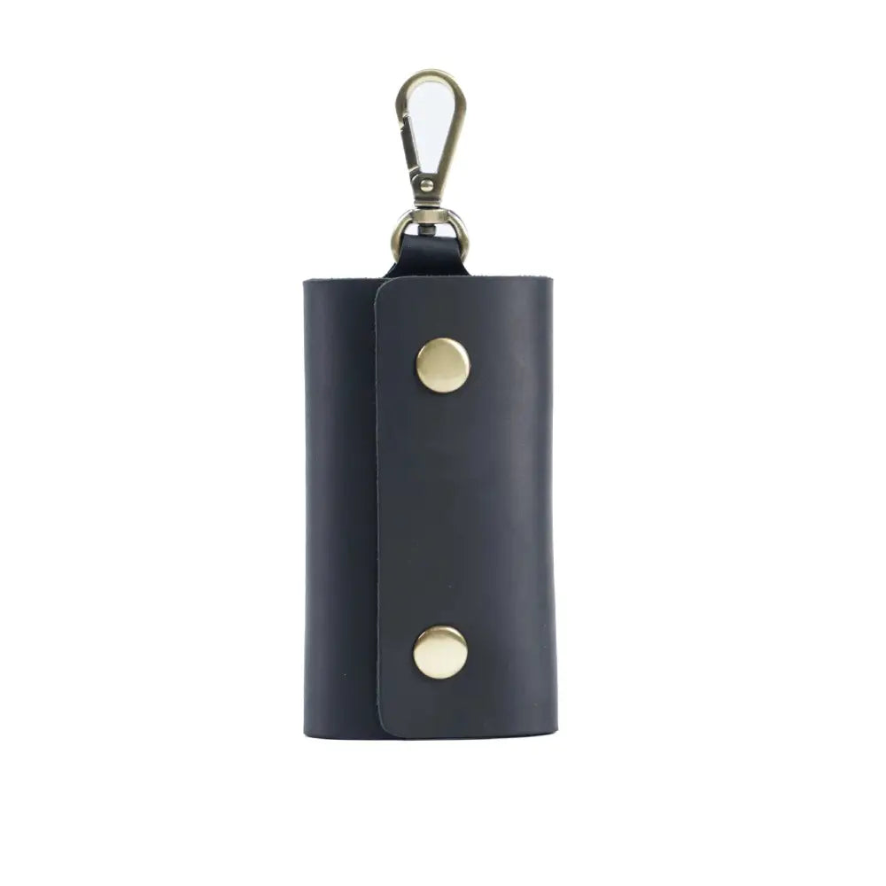Dark navy leather men’s minimalist wallet and key organizer case with gold snap buttons and silver carabiner clip