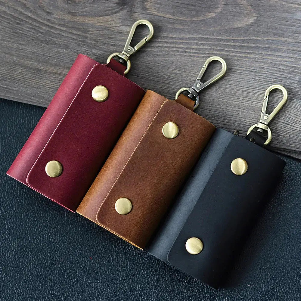 Men’s minimalist leather wallet and key organizer case in burgundy brown and black with brass snap buttons and carabiners