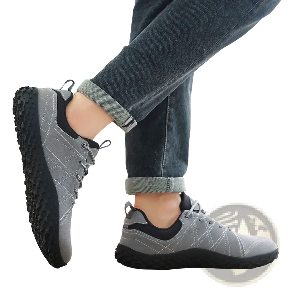 Gray and black waterproof leather hiking shoes for men with stitched upper and textured rubber sole for durability