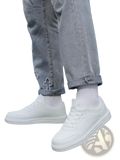 Men white leather minimalist low top sneakers featuring a smooth leather upper and clean minimalist design