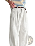 Men white pleated wide leg suit pants featuring a front pleat and brown belt for formal wear