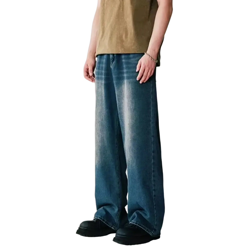 Men wide leg distressed denim jeans in faded blue wash with subtle distressing and relaxed straight-cut silhouette