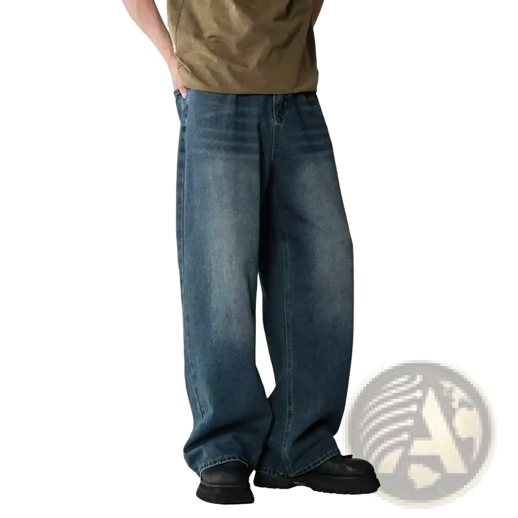 Men wide leg distressed denim jeans in faded medium blue wash with subtle whiskering and frayed hems