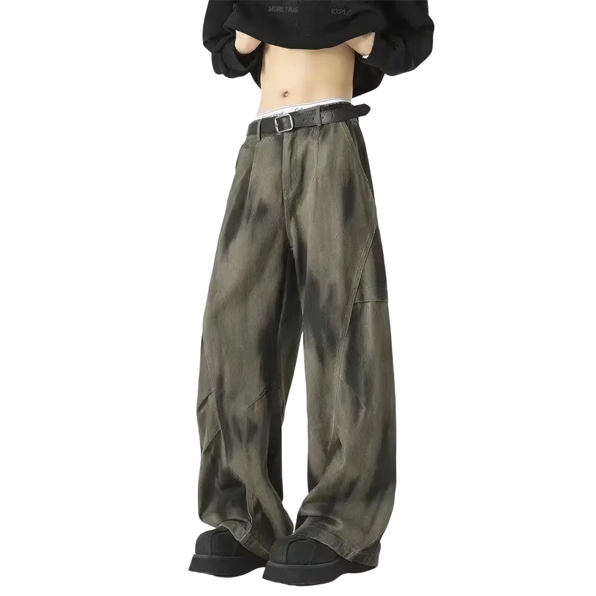 Men wide leg tie dye denim jeans in olive green with a black belt showcasing a modern casual style