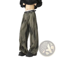 Men wide leg tie dye denim jeans in olive green with a black belt showcasing a modern casual style