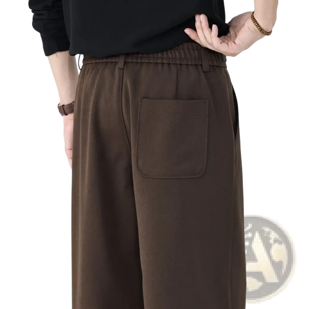Men wool blend brown vintage pleated trousers back view showing elastic waistband and single patch pocket