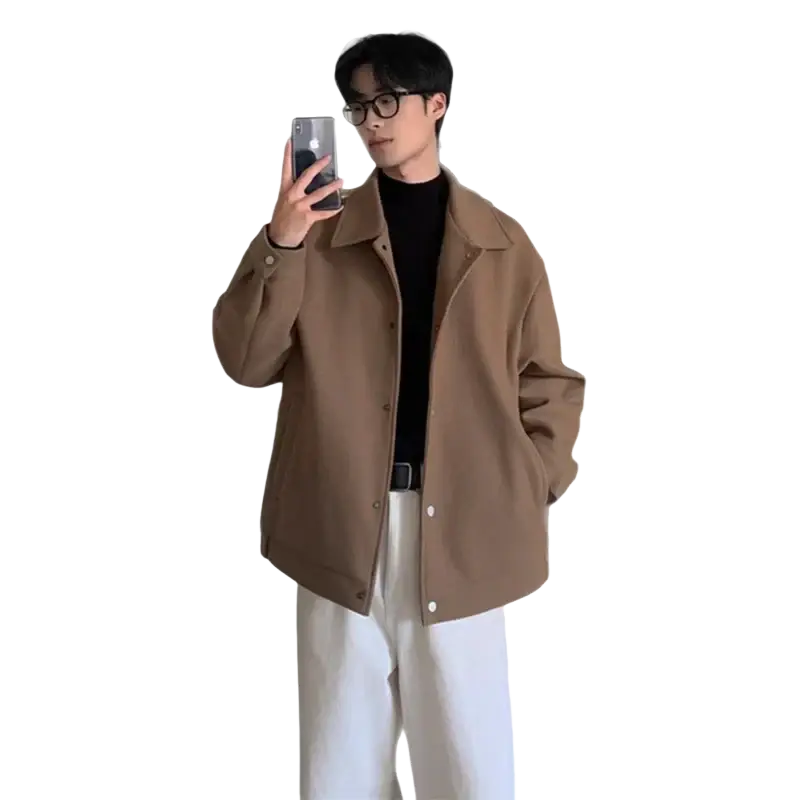 A tan oversized wool mid length coat with a relaxed fit and classic collar for warm winter wear
