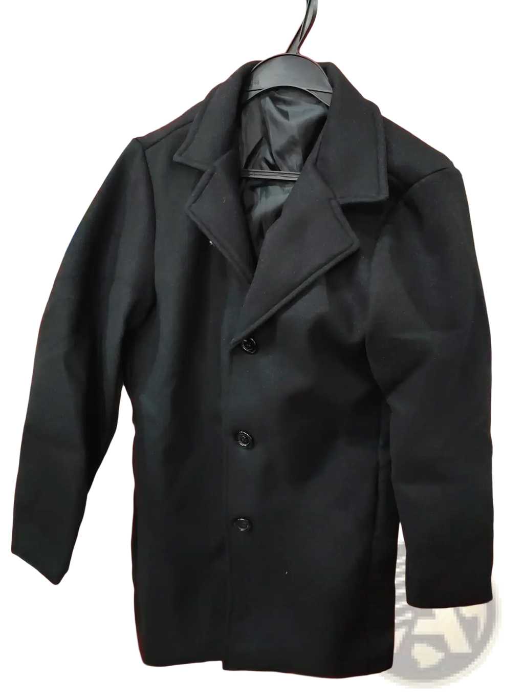 Black woolen double-breasted trench coat with classic collar and matching buttons hanging on a hanger for men