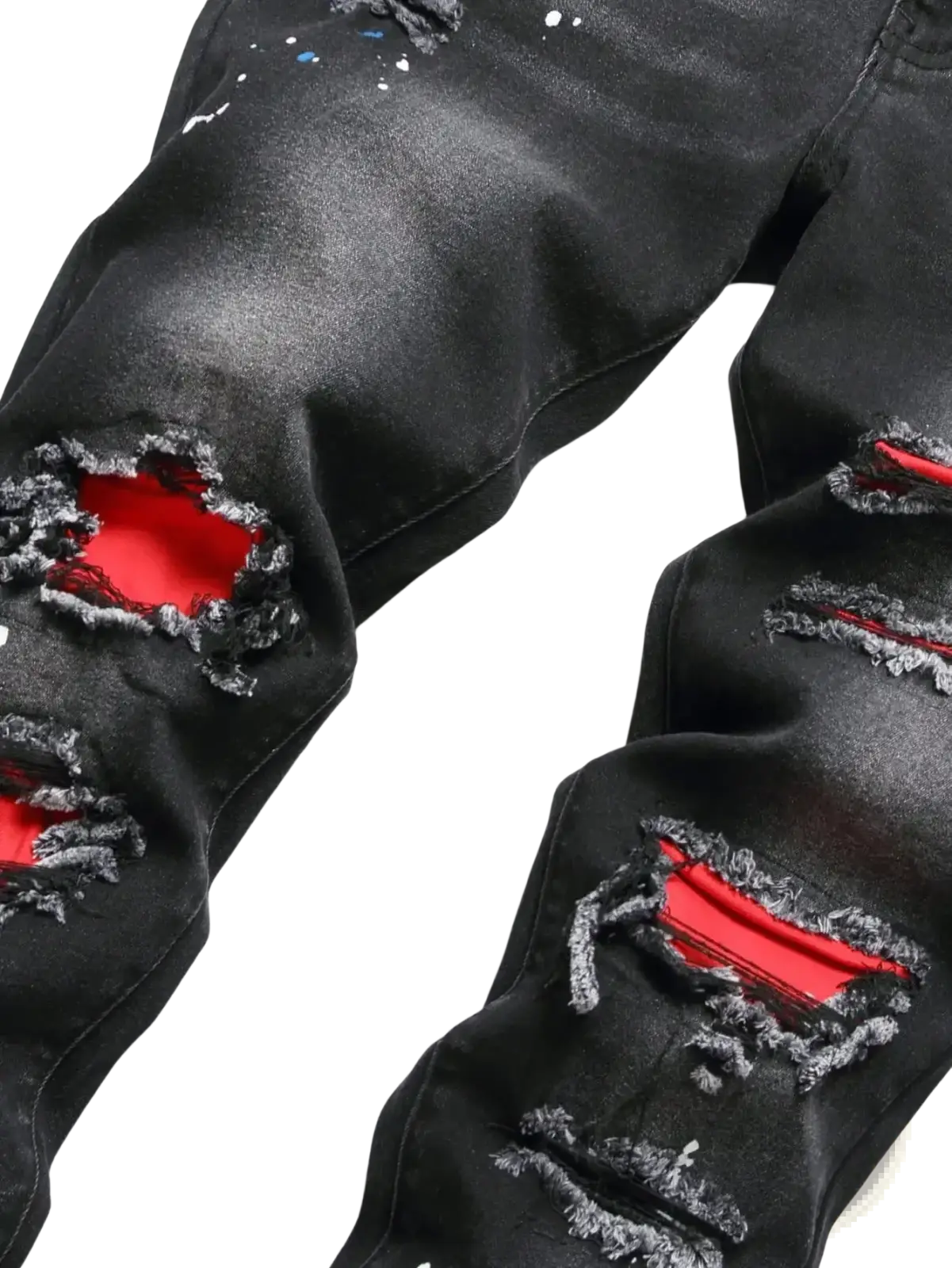 Men y2k stretchy skinny ripped denim jeans in black distressed denim with bold red inner lining and splattered paint accents