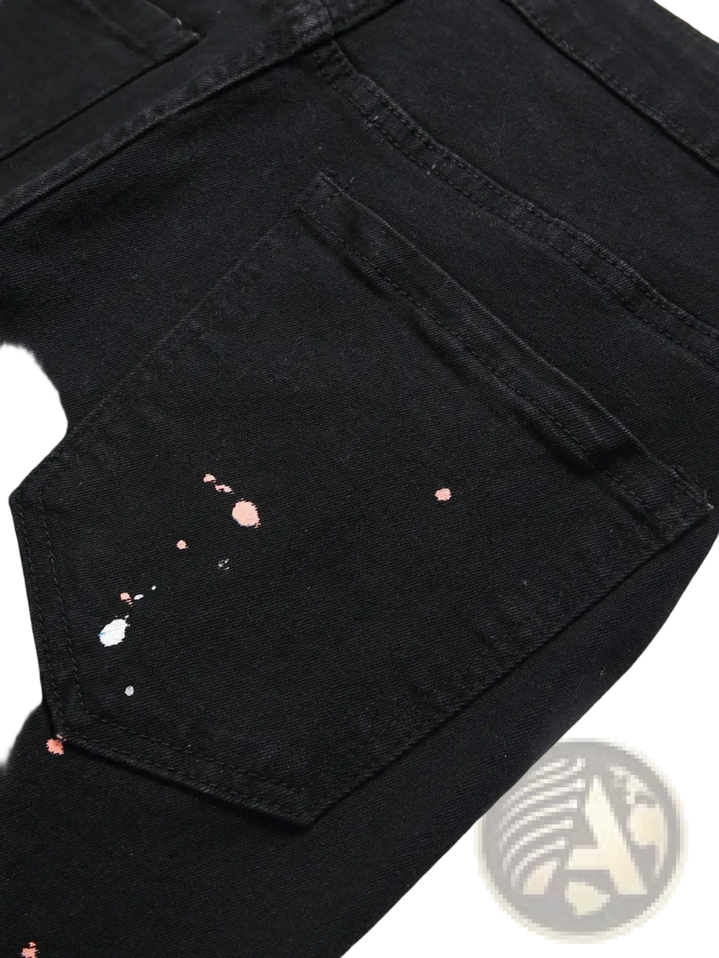 Men y2k stretchy skinny ripped denim jeans in black featuring a distressed pocket with pink and white paint splatter accents