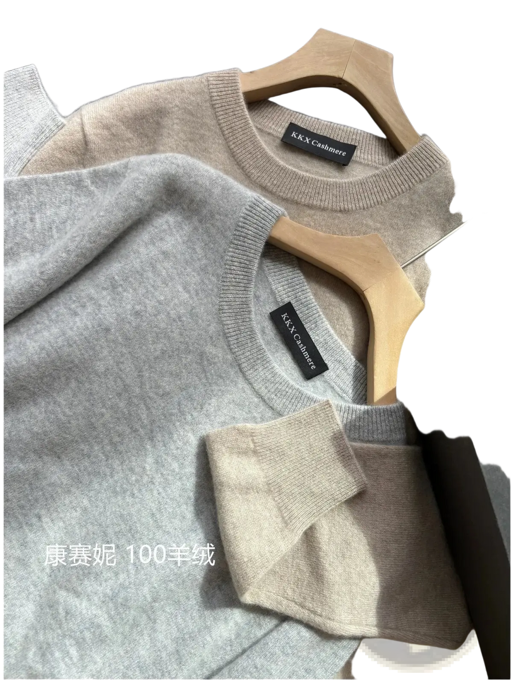 Three k&k cashmere men’s 100% merino wool crewneck sweaters in gray beige and navy blue on wooden hangers