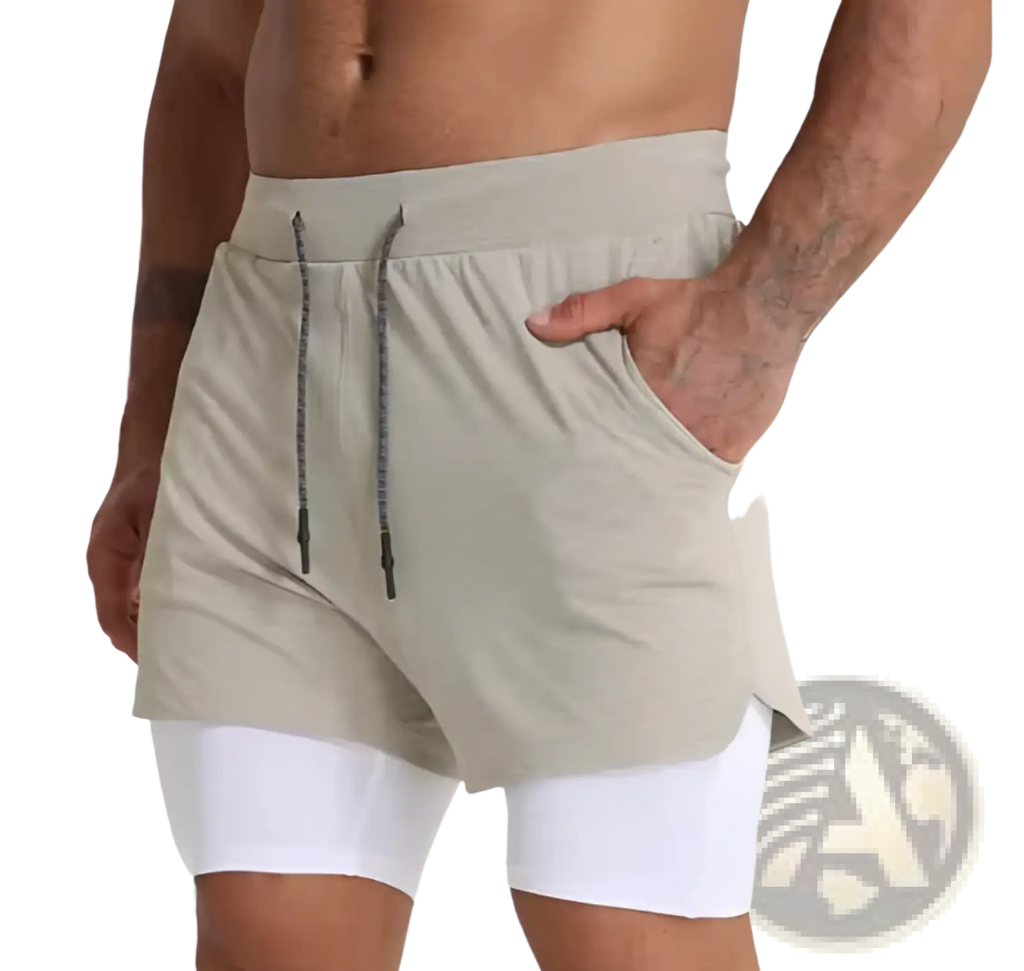 Men’s beige 2-in-1 breathable quick dry athletic training shorts with drawstring waistband and side pockets over white compression leggings