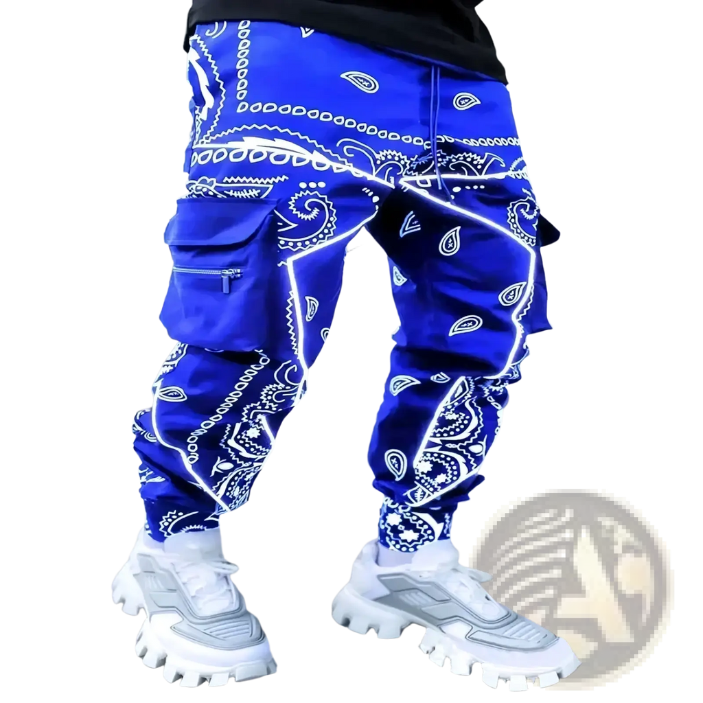 Men’s bandana print loose cargo pants in vibrant royal blue with white paisley and geometric designs and multiple pockets