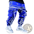 Men’s bandana print loose cargo pants in vibrant royal blue with white paisley and geometric designs and multiple pockets