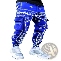Men’s bandana print loose cargo pants in vibrant royal blue with white paisley and geometric designs and multiple pockets