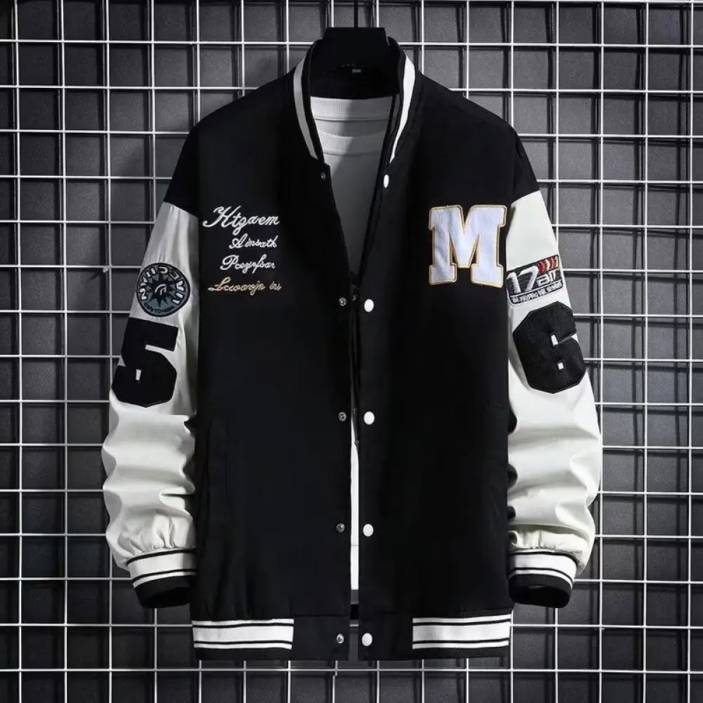 Men’s urban letter print streetwear varsity jacket in black and white with embroidered lettering patches and bold sleeve numbers