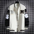 Men’s urban letter print streetwear varsity jacket with white and black colors, bold lettering, embroidered patches, and contrasting sleeves