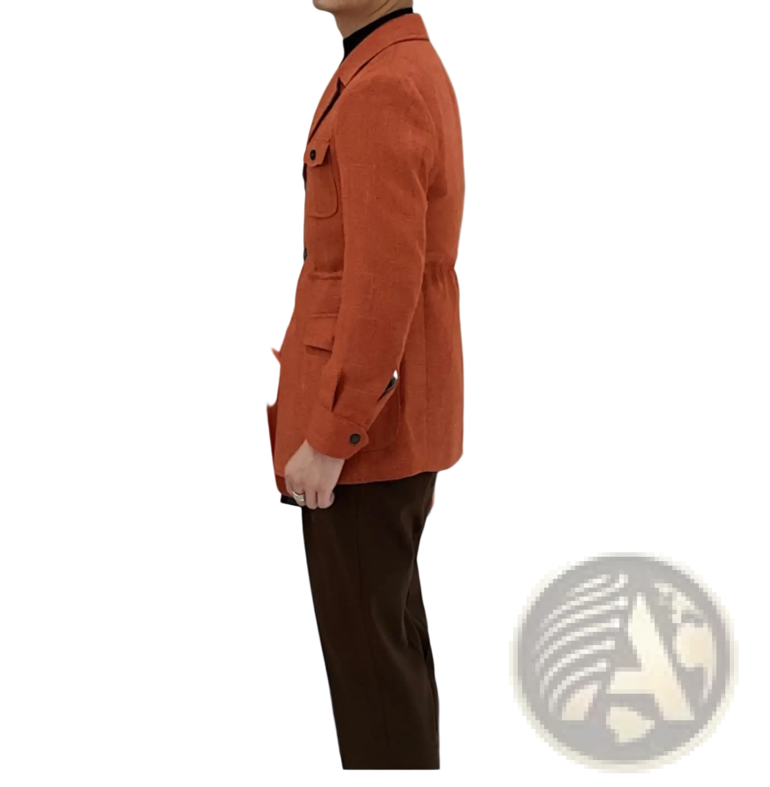 A man wearing a men’s belted slim fit blazer jacket in rust-orange wool with black trim and buttoned flap pockets