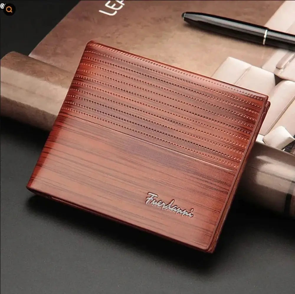 Fuerdanni men’s perforated leather bifold card wallet in brown with textured striped pattern and silver embossed branding