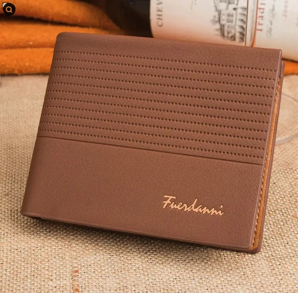 Brown leather bifold card wallet with perforated texture and gold-colored Fuerdanni branding for men