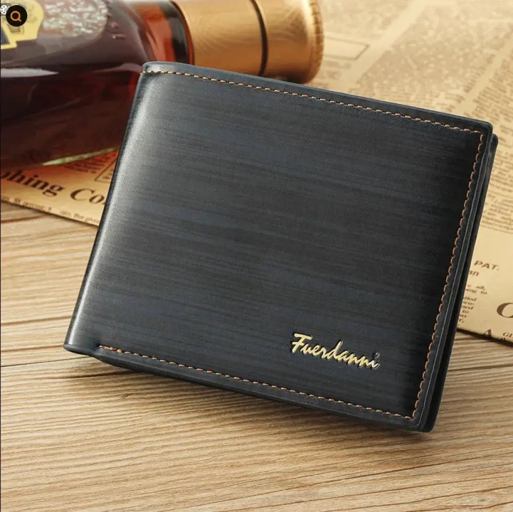 Black textured leather bifold wallet with gold stitching and fuerdann logo embossed for men’s card storage